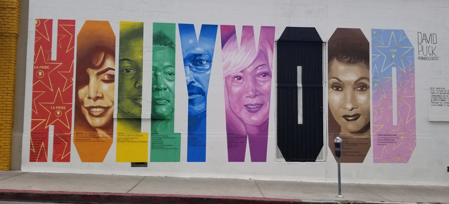 mural on McCadden near Hollywood Boulevard of the word Hollywood in different colors and with different members of the LGBT community depicted